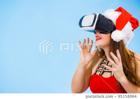 Girl watching 3d film tour in virtual reality glasses. Girl watching 3d film tour in virtual reality glasses. 95158064