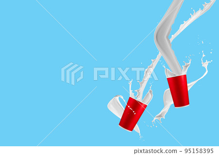 Paper cups with milk splashes on blue background. Disposable cup with white milk splashes. 95158395