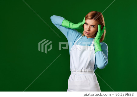 tired blonde woman in gloves and cleaner apron tired blonde woman in gloves and cleaner apron 95159688