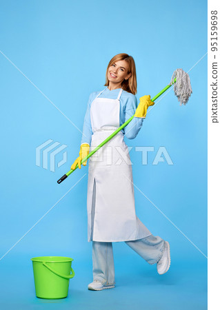 woman in rubber gloves and cleaner apron washing floor with mop woman in rubber gloves and cleaner apron washing floor with mop 95159698