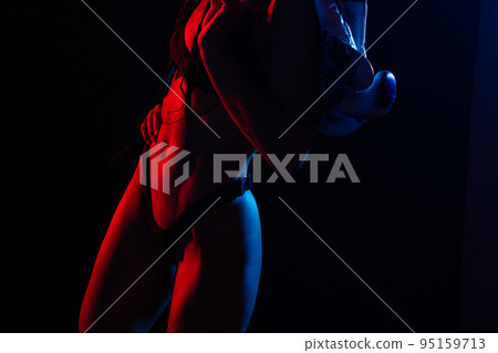 Close-up shot of young woman waist with muscular abdominal muscles. Abs of fit female athlete. 95159713