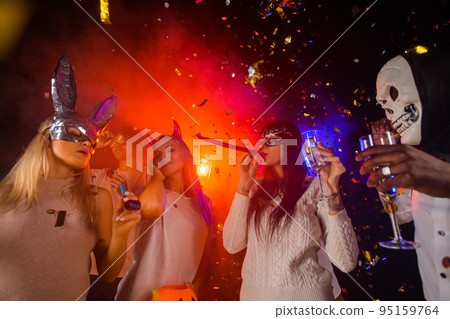 People dance at Halloween party People dance at Halloween party 95159764