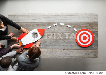 Business people with rocket 95160384