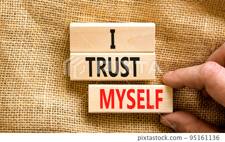 I trust myself symbol. Concept words I trust myself on wooden blocks. Businessman hand. Beautiful canvas table canvas background. Business, psychological and I trust myself concept. Copy space. I trust myself symbol. Concept words I trust myself on wooden blocks. Businessman hand. Beautiful canvas table canvas background. Business, psychological and I trust myself concept. Copy space. 95161136