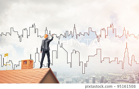 Man architect draw silhouette of modern city on blue sky. Mixed Man architect draw silhouette of modern city on blue sky. Mixed 95161508