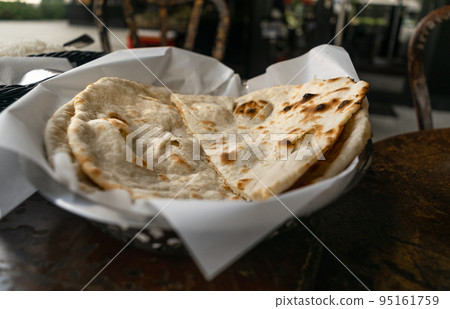 Indian Flat Bread, Chapati, Naan Closeup Indian Flat Bread, Chapati, Naan Closeup 95161759