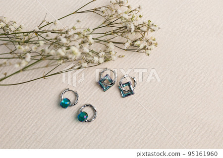 Handmade jewelry on a textile background. Gift for women. Bijouterie and jewellery for women Handmade jewelry on a textile background. Gift for women. Bijouterie and jewellery for women 95161960