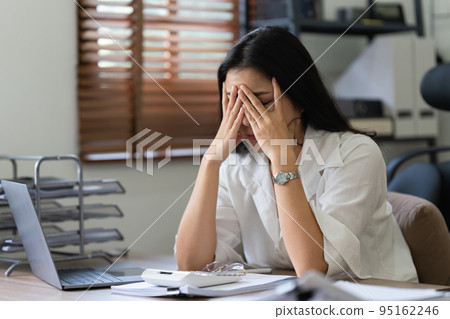 Asian business woman worry about marketing plan of this years. Account, Real Estate Agent, Finance concpet Asian business woman worry about marketing plan of this years. Account, Real Estate Agent, Finance concpet 95162246