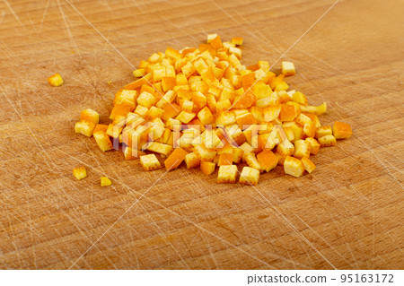 Raw Chopped Orange Peel, Zest on Wood Background 95163172