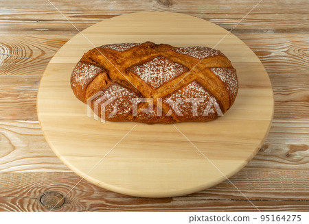 Freshly Baked Traditional Bread on Wooden Background 95164275