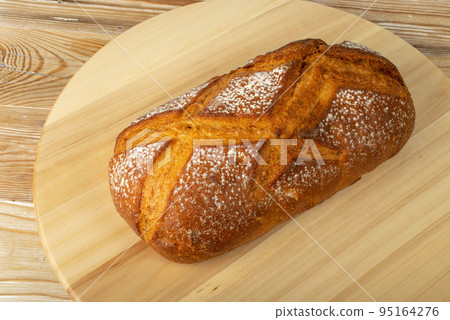 Freshly Baked Traditional Bread on Wooden Background 95164276