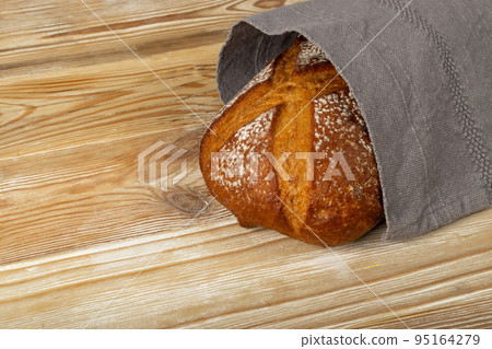 Freshly Baked Traditional Bread on Wooden Background Freshly Baked Traditional Bread on Wooden Background 95164279