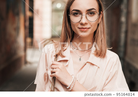 Close Up Portrait of Confident Elegant Woman in Glasses Looking Straight to the Camera, Stylish Blonde Girl with Eyeglasses Walking Outdoors in the City. 95164814