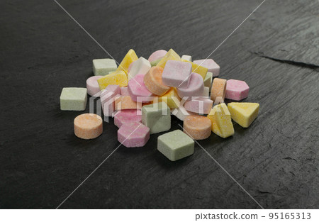 Tablet Candies on Black Stone, Compressed Tablets 95165313