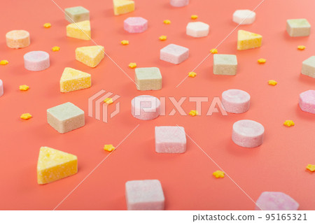 Tablet Candies on Pink Texture Background Pattern 95165321