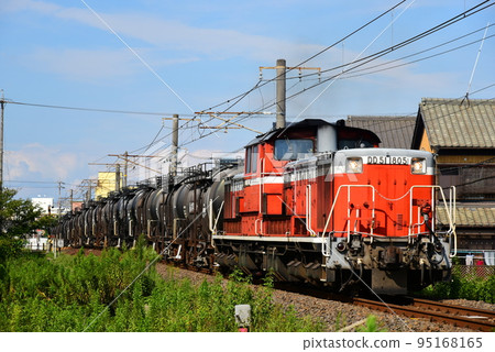 A cement freight train pulled by a Japanese National Railways diesel locomotive 95168165