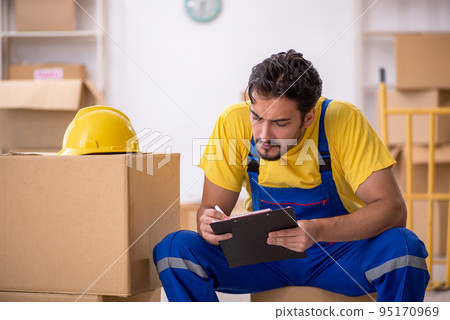 Young male contractor doing home relocation Young male contractor doing home relocation 95170969