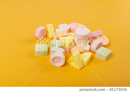 Scattered Tablet Candies on Black, Compressed Tablets 95173038