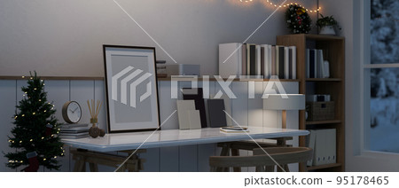 Picture frame mockup on minimal white tabletop with home decor against the white wall 95178465