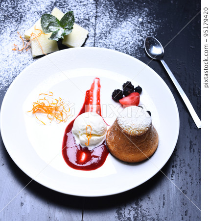 Dessert served orange noodles in cafe or bakery. Patisserie concept 95179420
