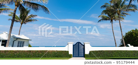 gate access with fence and door with palm trees 95179444