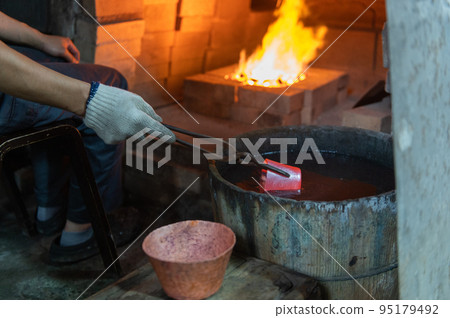 Craftsmen's handiwork Traditional copperware production Craftsmen's handiwork Traditional copperware production 95179492