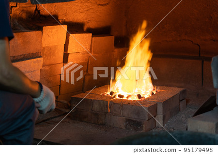 Craftsmen's handiwork Traditional copperware production 95179498