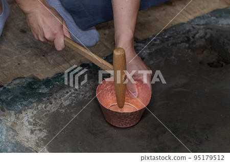 Craftsmen's handiwork Traditional copperware production Craftsmen's handiwork Traditional copperware production 95179512