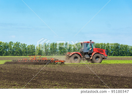 Tractor on the field Tractor on the field 95180347