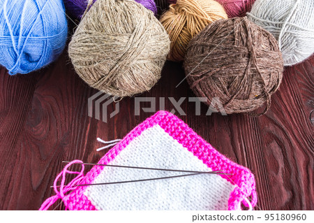 knitting ball of yarn and knitting needles 95180960