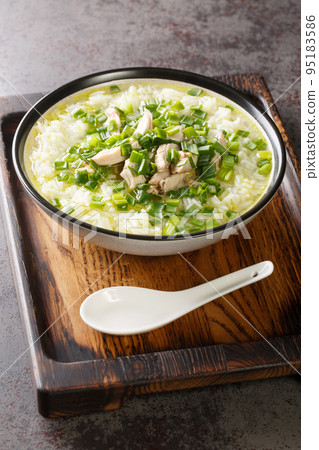 Dak Gomtang Korean Chicken Soup close-up in a bowl. Vertical Dak Gomtang Korean Chicken Soup close-up in a bowl. Vertical 95183586