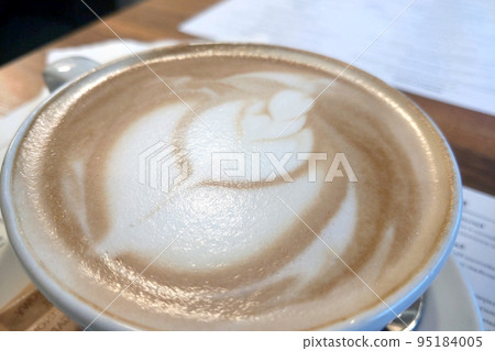 View of a fresh and delicious cup of coffee on the table in the cafe. 95184005