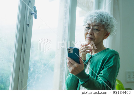 Rain Anxious senior woman 95184463