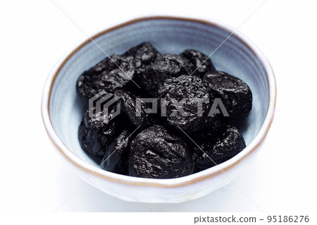 Dried prunes on white background Dried prunes on white background 95186276
