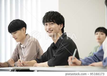 Young men and women taking classes Seminar/lecture Image 95188173