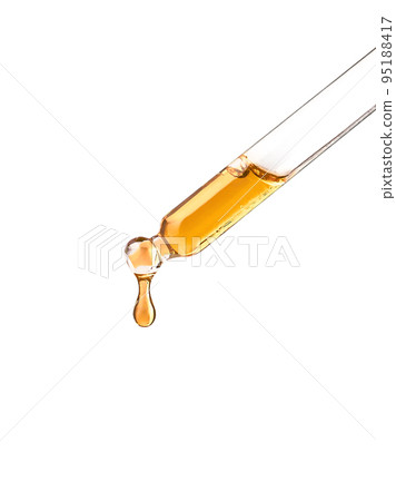 Cosmetic pipette with yellow oily drop on white bg Cosmetic pipette with yellow oily drop on white bg 95188417