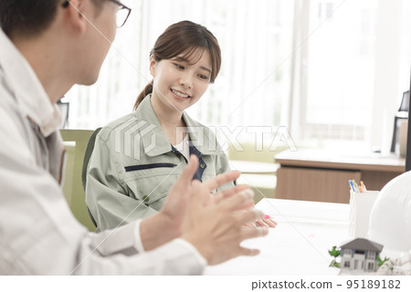 Male and female engineers having a meeting Male and female engineers having a meeting 95189182
