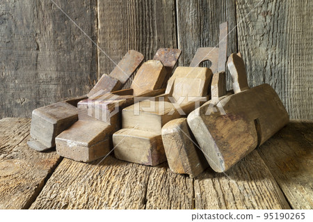 Antique wooden plane on the table 95190265