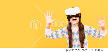 happy teen girl wear vr glasses using future technology for education in virtual reality, innovation. Banner of child girl with virtual reality vr headset, studio portrait with copy space. happy teen girl wear vr glasses using future technology for education in virtual reality, innovation. Banner of child girl with virtual reality vr headset, studio portrait with copy space. 95190328