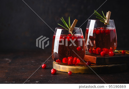 Festive Cranberry and rosemary cocktail with ice. Alcoholic or non-alcoholic cocktail 95190869