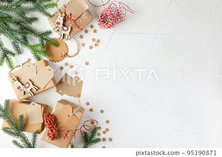 Christmas giftbox and presents wrapping in craft paper and decor Christmas giftbox and presents wrapping in craft paper and decor 95190871