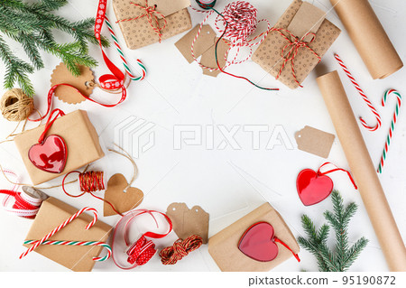 Christmas giftbox and presents wrapping in craft paper and decor Christmas giftbox and presents wrapping in craft paper and decor 95190872