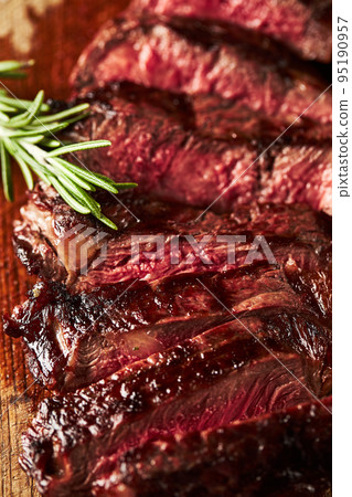 Close up of grilled Medium Rare Ribeye steak with salt cristals Close up of grilled Medium Rare Ribeye steak with salt cristals 95190957