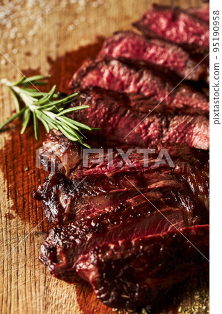 Close up of grilled Medium Rare Ribeye steak with salt cristals Close up of grilled Medium Rare Ribeye steak with salt cristals 95190958