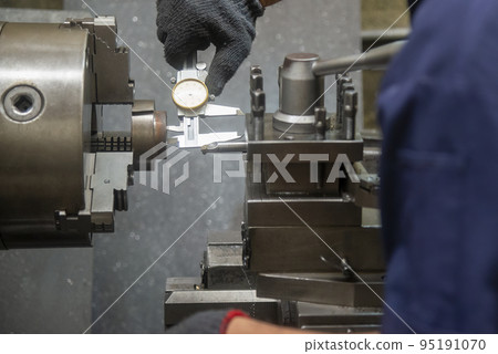 Close up scene the operator measuring inside diameter casting parts by dial Vernier caliper. Close up scene the operator measuring inside diameter casting parts by dial Vernier caliper. 95191070