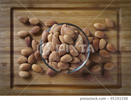 Almond nuts in a bowl 95191598