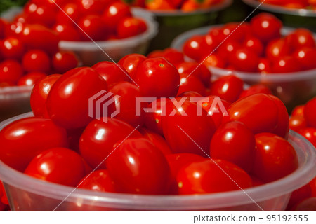 red tomatoes at market place, red tomatoes background. 95192555