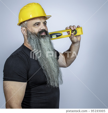 worker with helmet and spirit level. 95193005