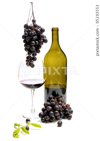 A bottle of wine and bunches of ripe grapes in a glass on a white background A bottle of wine and bunches of ripe grapes in a glass on a white background 95193553
