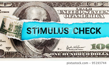 Stimulus Check. Torn bills revealing Stimulus Check words. Idea for USA check, Coronavirus affects 95193744